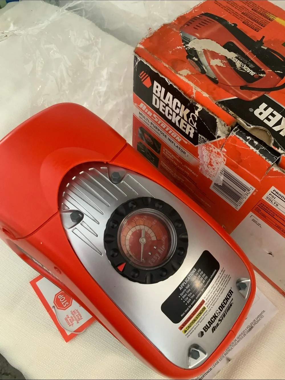 Black & Decker tire inflator. Manual included.